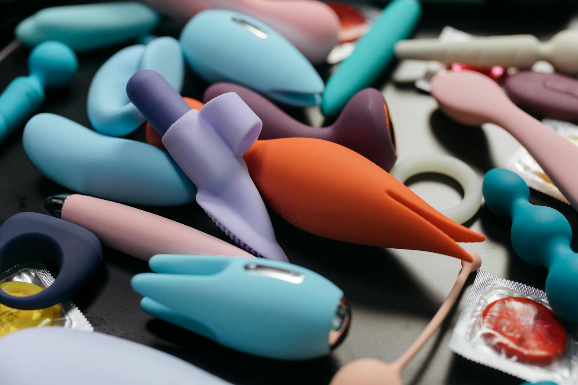 An array of vibrant clitoral vibrators and intimate wellness tools displayed together