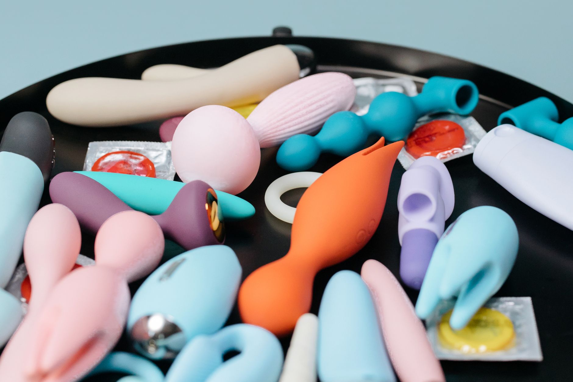 A couple holding a vibrator together, representing modern shared intimacy